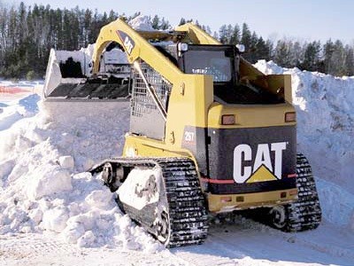 CAT Skid steer clearing and dumping snow